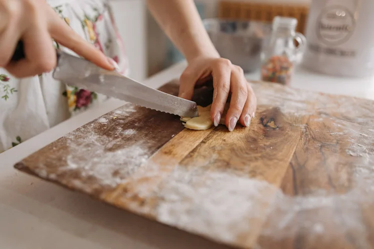 Woman using an handcrafted chopping board