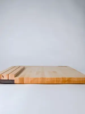 Maple edge grain cutting board with knife storage
