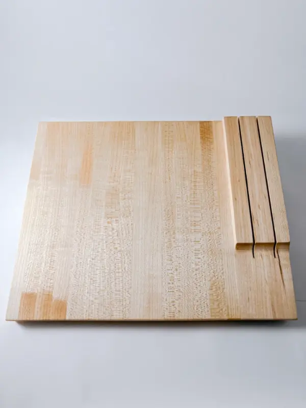 Maple edge grain cutting board with knife storage