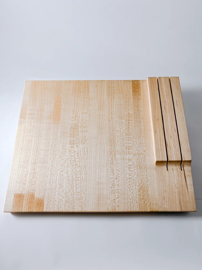 Maple edge grain cutting board with knife storage