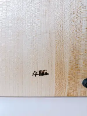Maple edge grain cutting board with knife storage logo