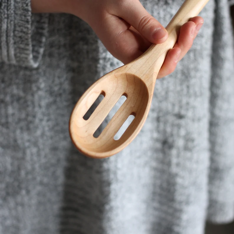 Handmade oval slotted wooden kitchen spoon