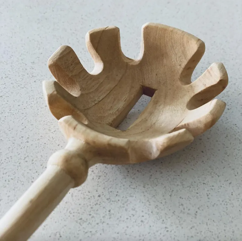 Hand carved wooden pasta spoon