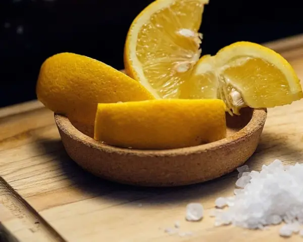 Cutting board maintenance: the complete guide Lemon slices with coarse salt on a cutting board